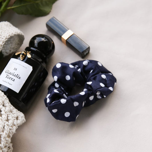 Navy polka dot cotton scrunchie — matching hair accessory styled with Celeste loungewear set
