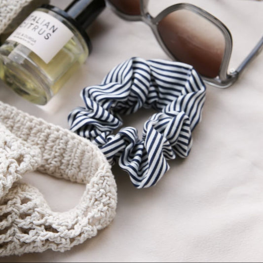 Navy and white stripe cotton scrunchie — matching hair accessory styled with summer loungewear