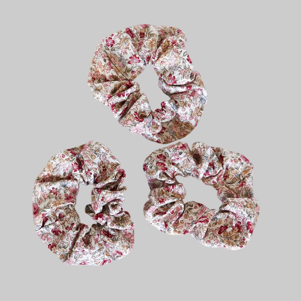 Wildflower Scrunchie detail — premium cotton hair scrunchie in red and pink wildflower floral print