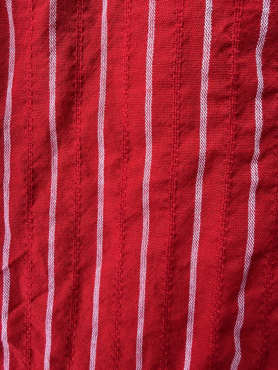 Valentina Scarlet lifestyle — women's scarlet red cotton dress styled for travel and slow living