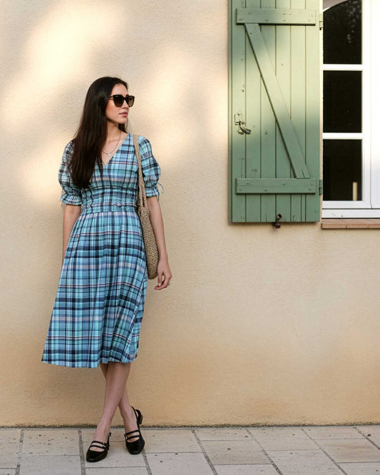 Clairo Meadow full length — women's mint and navy plaid cotton midi dress with tie sleeves styled outdoors
