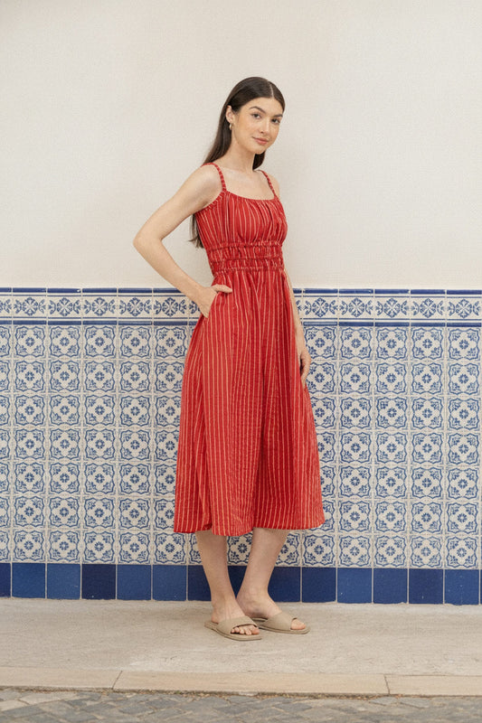 Valentina Scarlet lifestyle - women's scarlet red pinstripe cotton midi dress with side pockets, styled at a tiled Lisbon wall