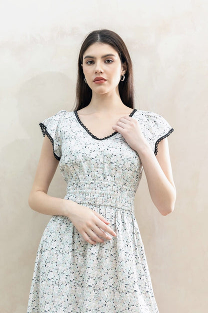 Juliet Black Blossom side view — flutter sleeve cotton midi dress with deep side pockets