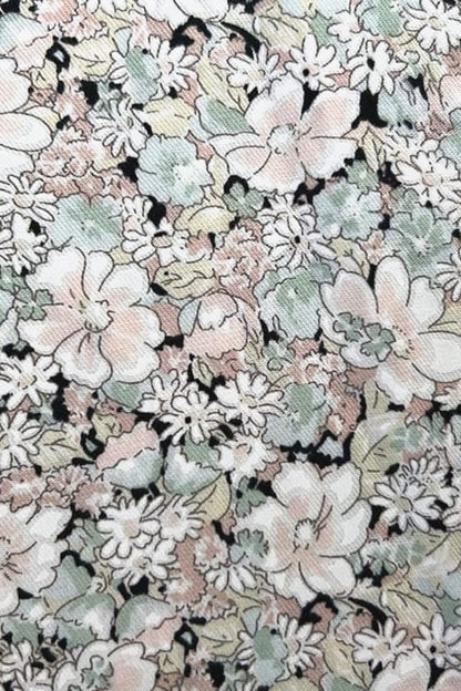 Juliet Black Blossom neckline detail — flutter sleeves and contrast lace trim on black floral cotton