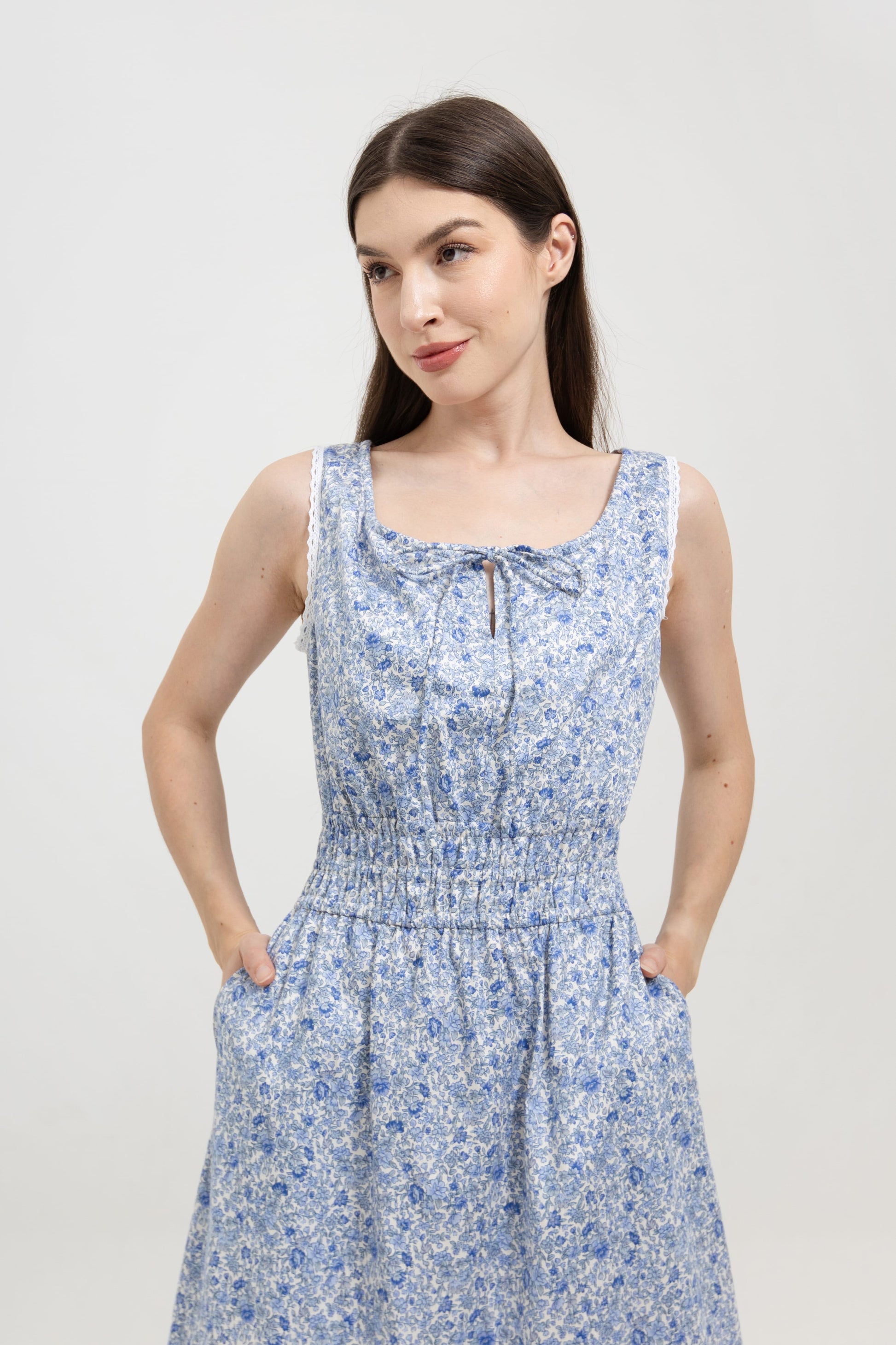 Bianca Blue Blossom back view — flowing tiered midi dress with deep side pockets