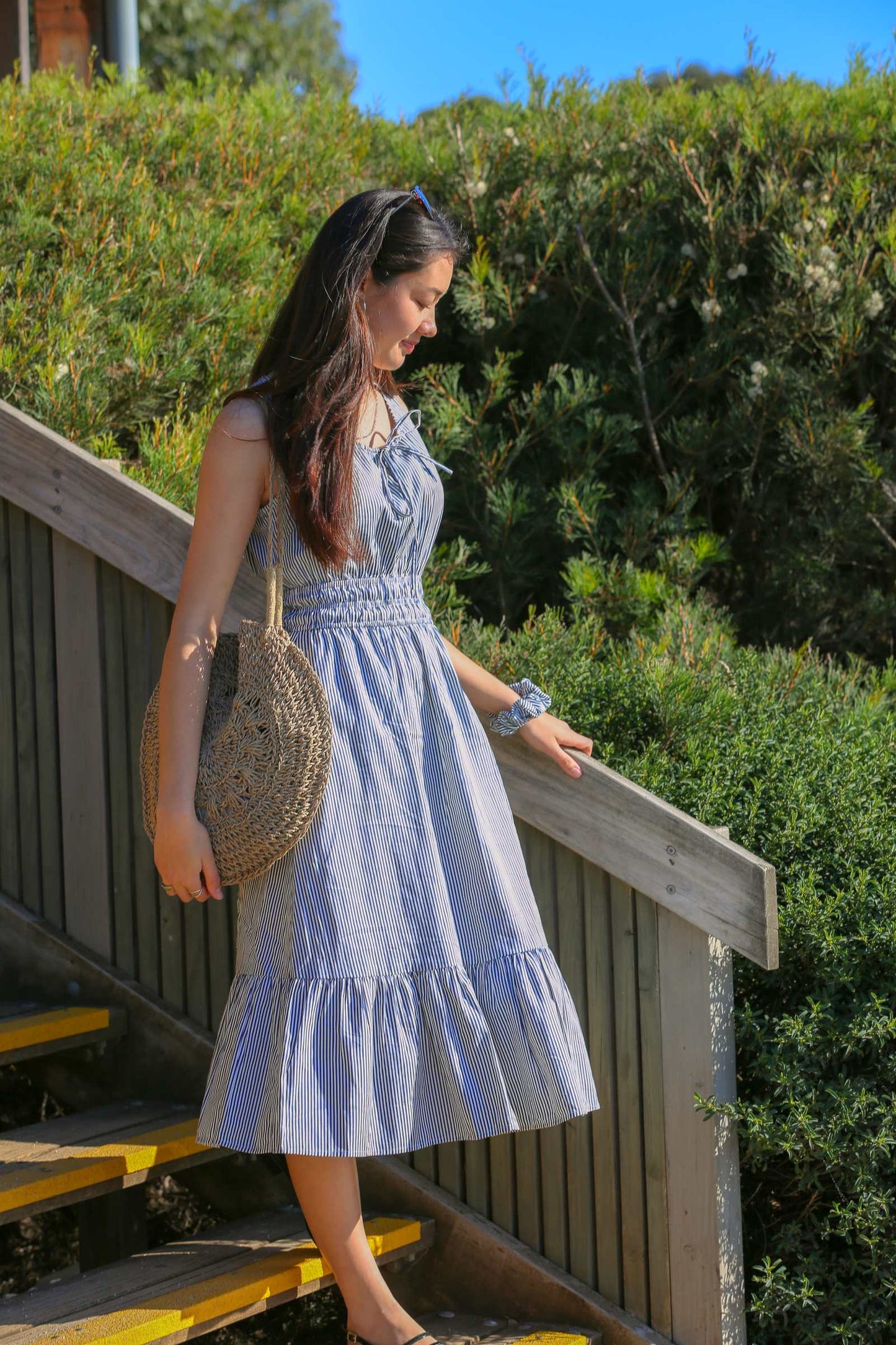 Martina Midnight — women's navy pinstripe cotton midi dress with scoop neckline and tiered skirt