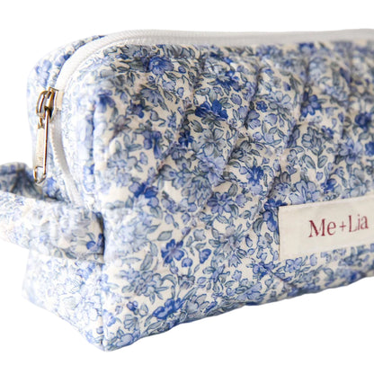 Blue Blossom Make-up Pouch Small — blue floral quilted cotton pouch, angled view with zip