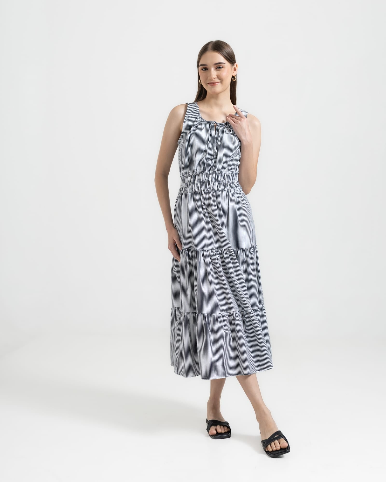 Martina Midnight front view — navy pinstripe cotton midi dress with front ties and A-line silhouette