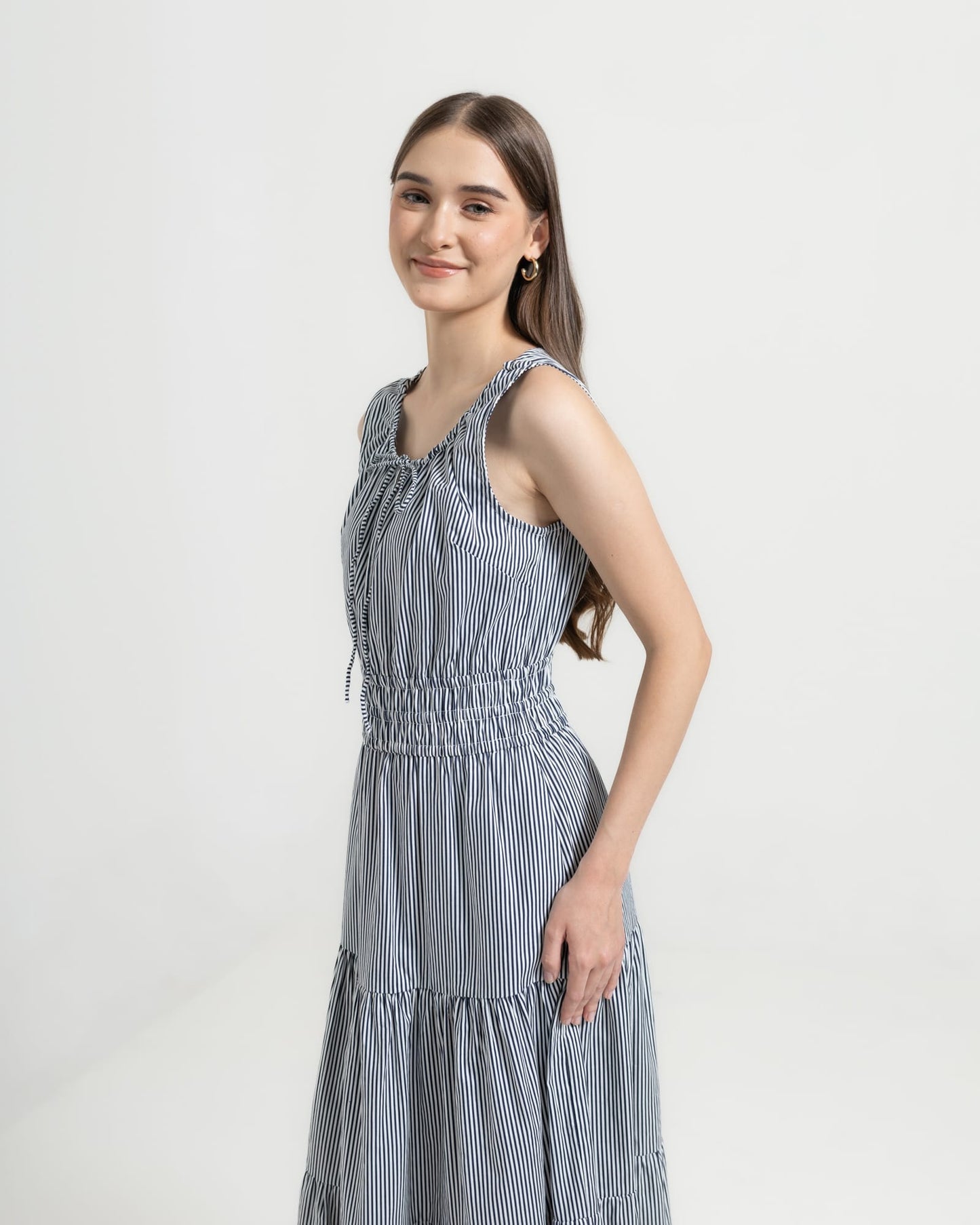 Martina Midnight side view — sleeveless navy pinstripe cotton midi dress with elasticated waist