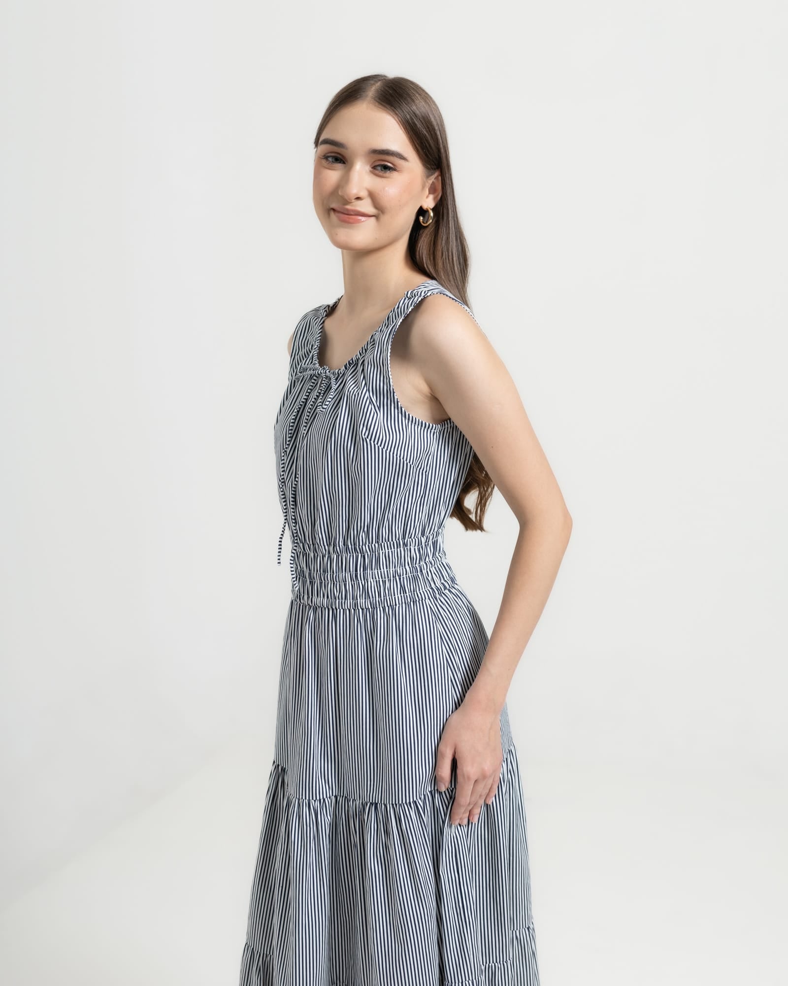 Martina Midnight side view — sleeveless navy pinstripe cotton midi dress with elasticated waist