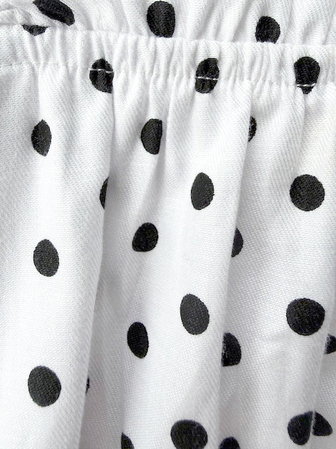 Mila Milk detail — white polka dot print on 100% premium cotton