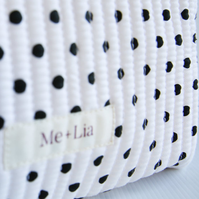 Polkadot Black Make-up Bag Large — black polka dot cotton travel bag held in hand