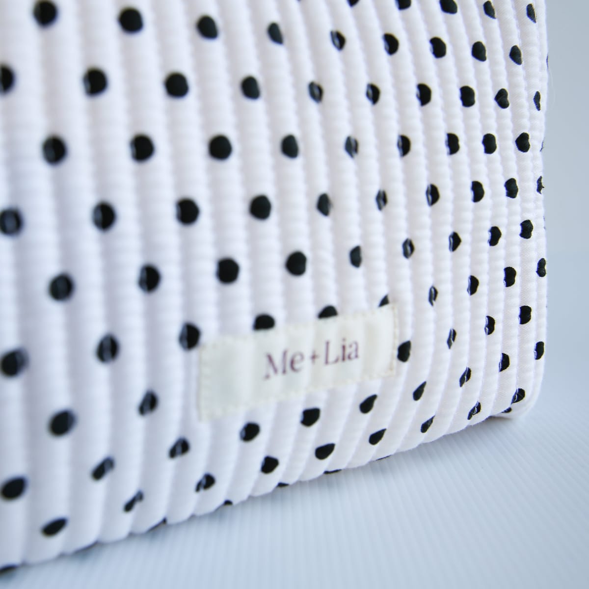 Polkadot Black Make-up Pouch Small — black polka dot cotton pouch held in hand
