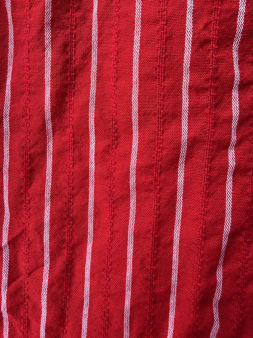 Valentina Scarlet lifestyle — women's scarlet red cotton dress styled for travel and slow living