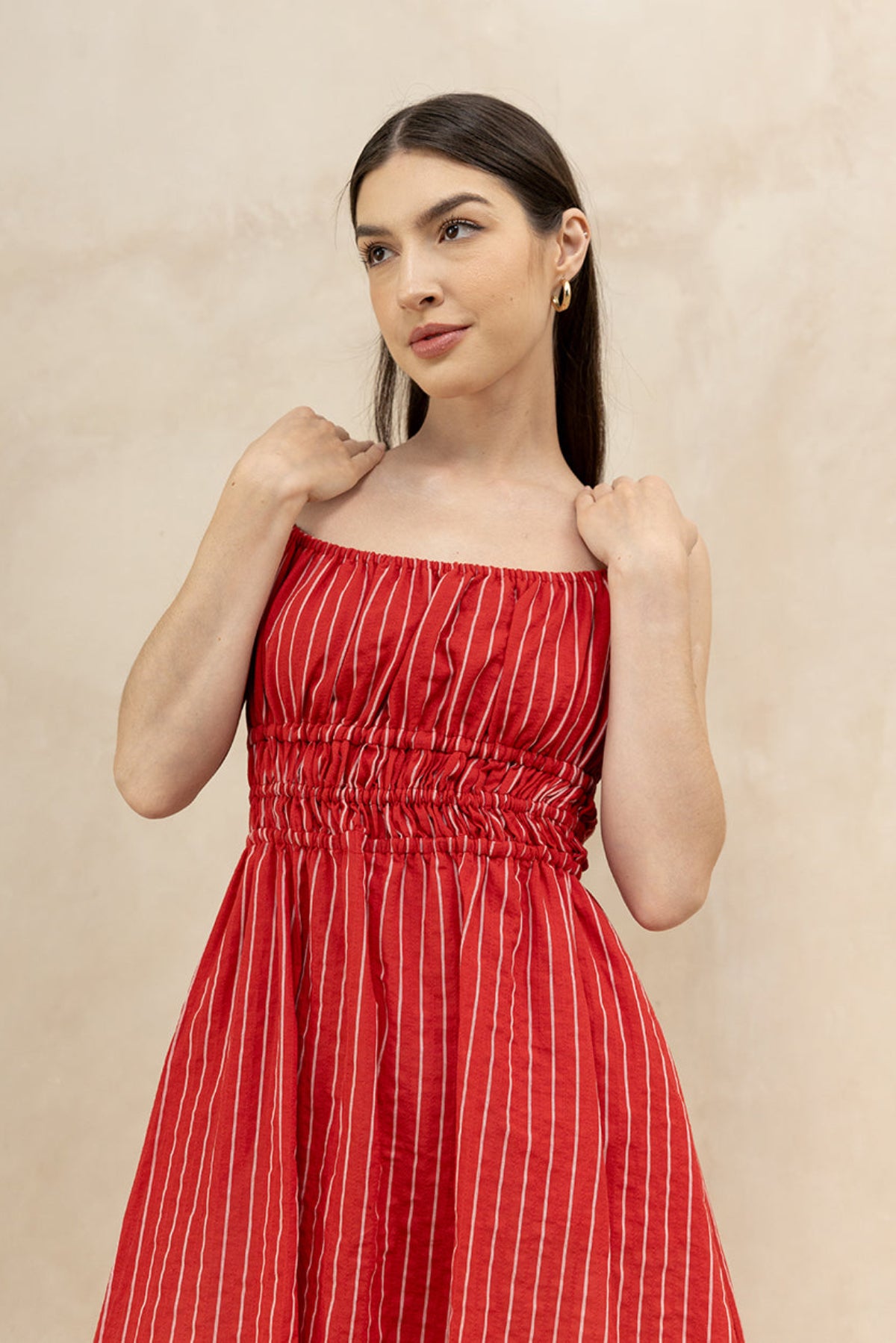 Valentina Scarlet side view — flowing red cotton midi dress with deep side pockets