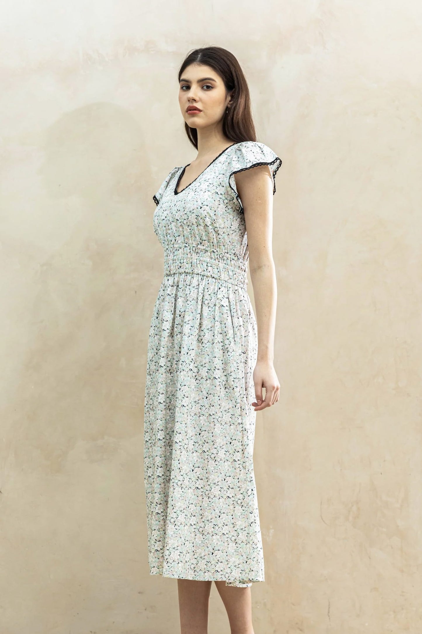 Juliet Black Blossom lifestyle — women's floral cotton dress styled outdoors