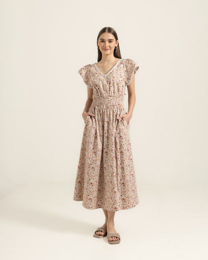 Juliet Wildflower dress studio front — V-neck lace trim, shirred waist and full cotton skirt with deep pockets