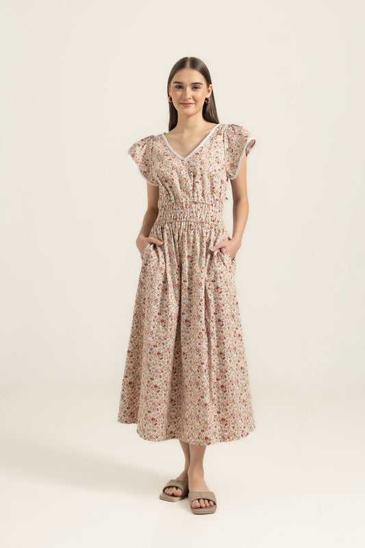 Juliet Wildflower dress studio front — V-neck lace trim, shirred waist and full cotton skirt with deep pockets