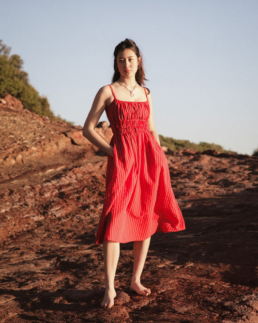 Valentina Scarlet striped cotton dress on a coastal path